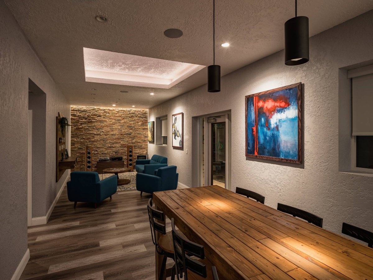 Listening lounge with stacked-stone feature wall in the AV Connect showroom