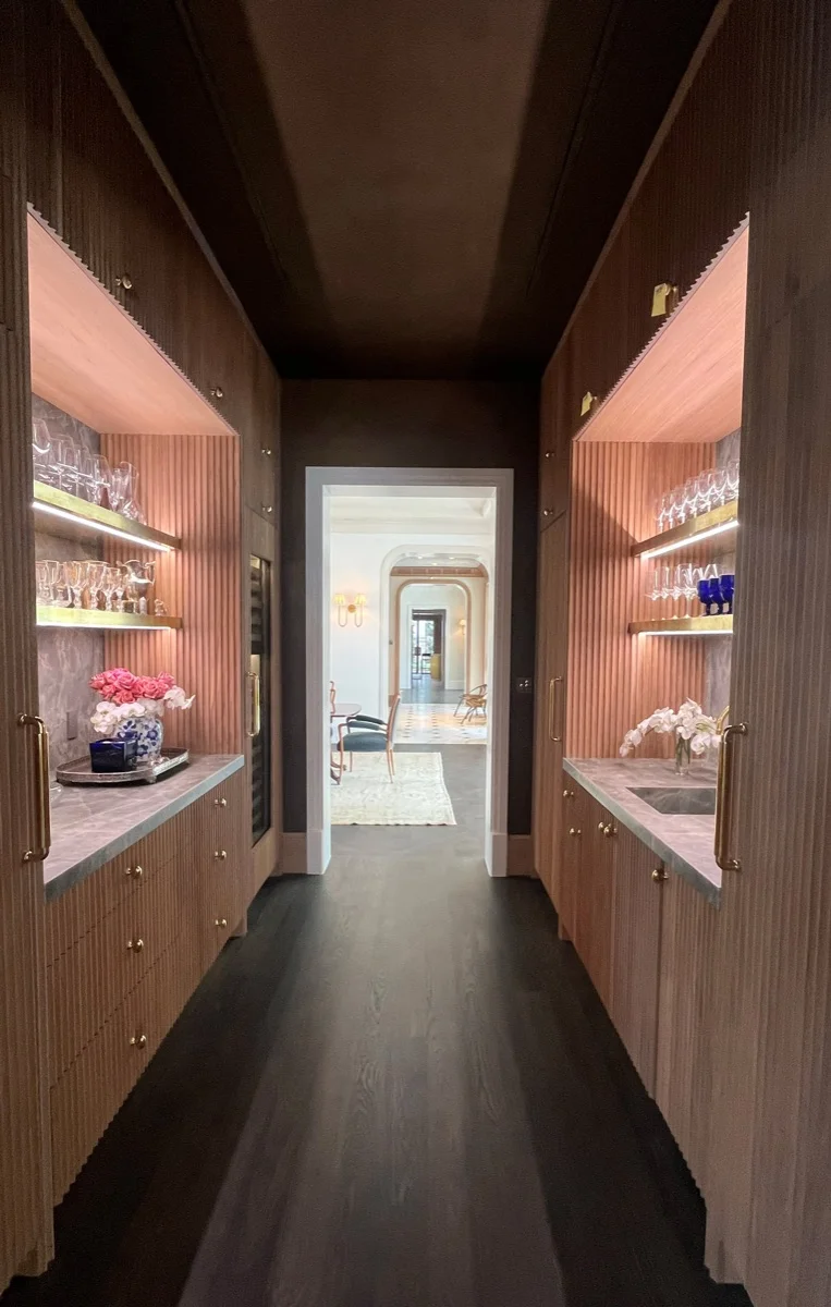 Wet bar and butler's pantry with backlit shelving in a high-end Austin, TX residence