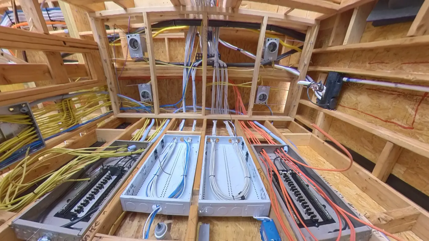 Structured wiring enclosure with labeled patch panels and home-run cabling installed during rough-in by AV Connect in Austin, TX