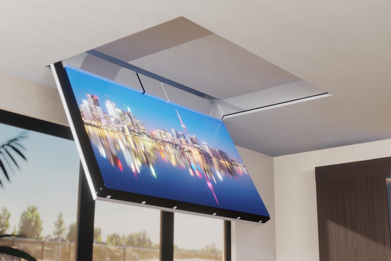 An in-ceiling TV displaying a city skyline being lowered. 