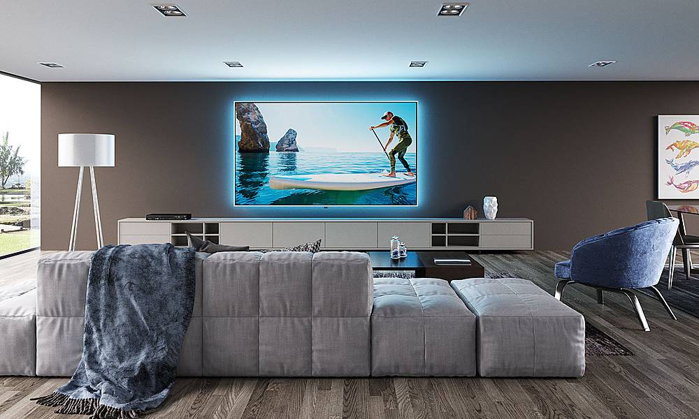 Modern looking living room with a big screen with blue backlight